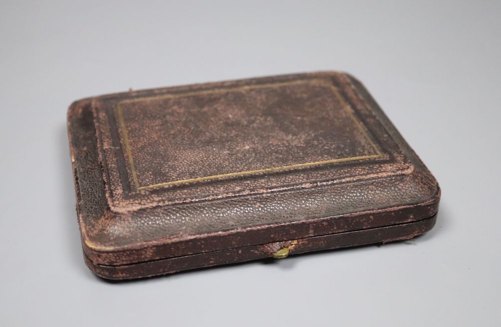 A 19th century white metal card case, the front and back embossed with Ganymede & the Eagle and cathedral, unmarked,